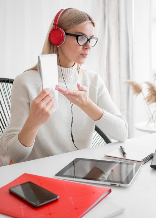 online-remote-courses-student-showing-her-notes